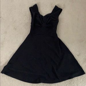 Black A line dress with open back and cross design